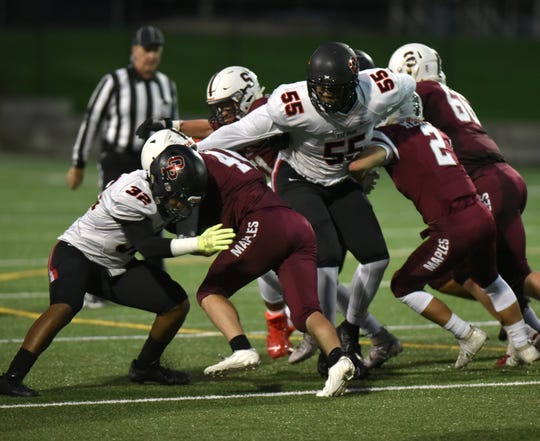 Birmingham Seaholm's O-line had their hands full trying to contain players like Rayshaun Benny (55) who seemed to appear in their backfields at the snap of the ball.