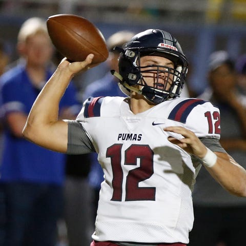Perry quarterback Chubba Purdy (12)  throws a pass