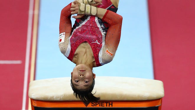 Gymnast Angelina Melnikova Stays Calm After Hair Issue During Routine
