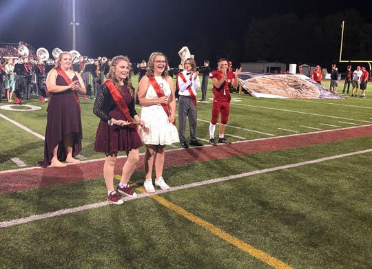 OCT 4, 2019 MILFORD HIGH SCHOOL, MILFORD, OHIO: Trinity Miller and Abigail Stropes are honored at midfield Friday, Oct. 4 at as Milford High School's homecoming Royalty honorees as selected by their peers. The Ohio high school has done away with the gender roles of homecoming king and queen forever so that any two students can be elected to the two Homecoming Royalty spots.