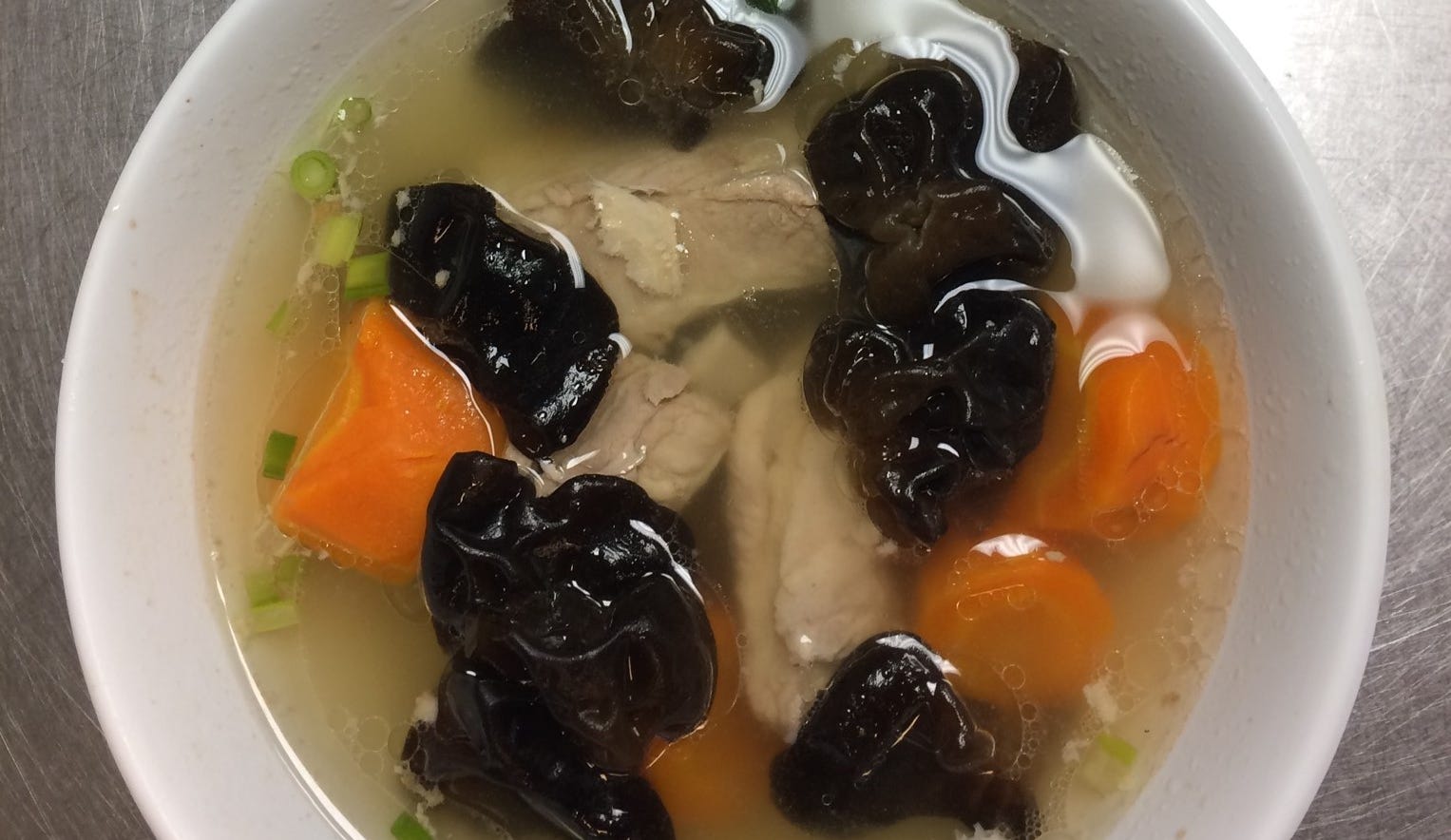 Wood ear mushrooms, carrot and pork ribs in broth is one of the traditional dishes served at Jing's, 207 E. Buffalo St., on the first floor of the Marshall Building.