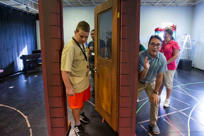 Golden Gate High School 9th grader Sonny Hogle participates in an acting exercise with Craig Price, director of community eduction and wellness at the Sugden Community Theatre, Monday, Oct. 7, 2019, in Naples.