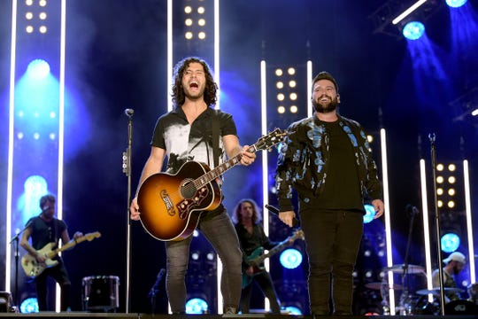 Dan Smyers and Shay Mooney of Dan + Shay perform at the 2019 CMA Music Festival on June 07, 2019 in Nashville, Tennessee.