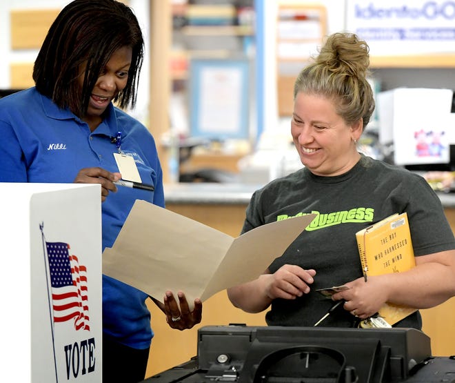 Nikki Suchanic, the director of elections and voter registration in York County, talks with Tiffany Counts of New Freedom during a voting machine demonstration at Paul Smith Library of Southern York County Monday, Oct. 7, 2019. York County voters will be using a paper ballot in upcoming elections. Bill Kalina photo