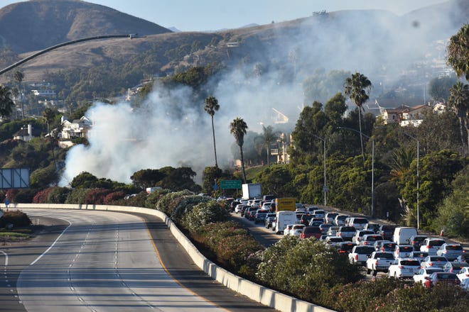 A brush fire was burning near Highway 101 in Ventura on Sunday afternoon.