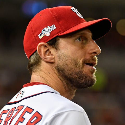 Max Scherzer (31) looks on from the dugout during 