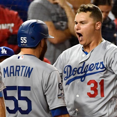 Joc Pederson greets Russell Martin and Chris Taylo