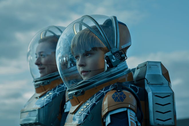 Will Robinson (Maxwell Jenkins) and his mother, Maureen (Molly Parker), deal with common family matters and uncommon, plus life-threatening dangers, in Netflix's "Lost in Space."