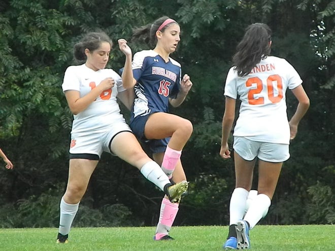 Governor Livingston's Caroline Freer (15) tries to work her way around two Linden defenders on Monday, Oct. 7, 2019.