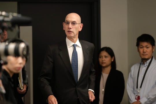 NBA Commissioner Adam Silver arrives for a news conference before an NBA preseason basketball game between the Houston Rockets and the Toronto Raptors Tuesday, Oct. 8, 2019, in Saitama, near Tokyo.