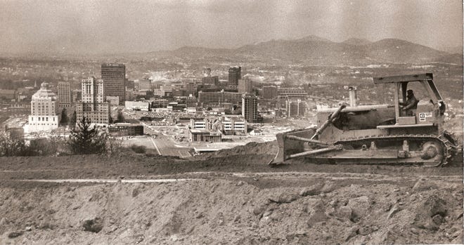 Asheville as seen from the top of Beaucatcher Mountain in February 1977. Work began with the moving of 3 million cubic yards of dirt and rock from the open cut through the mountain, which would connect the Crosstown Expressway with I-40 east.