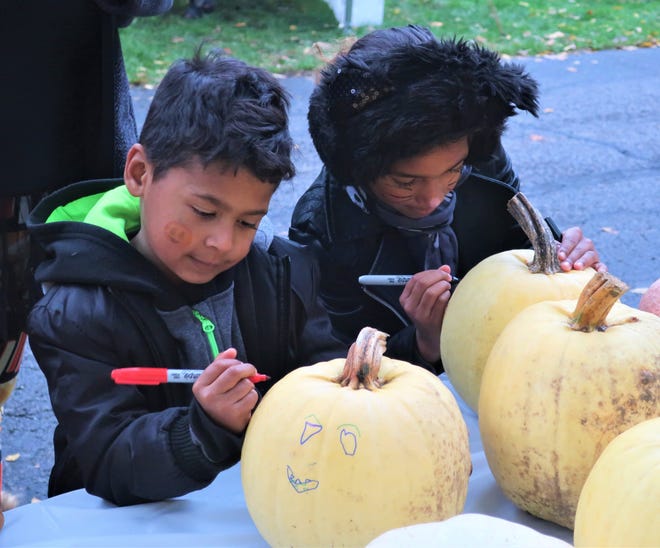 Children decorate pumpkins during a previous free family night at Spiegel Grove.