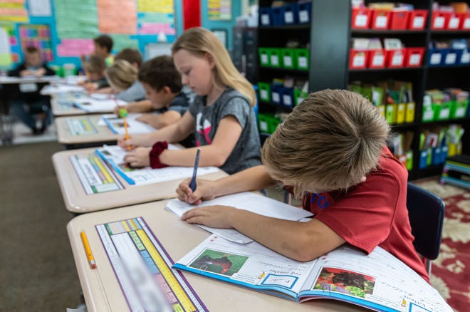 Third-graders at Lake Country School in Delafield practice cursive writing on Tuesday, Oct. 8, 2019.