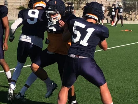Sione Tupou (center) competes in a drill Wednesday at UTEP's football practice at Glory Field