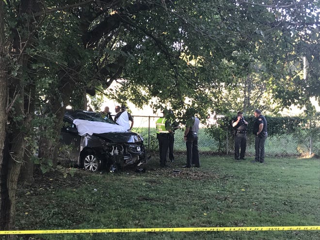 Police investigate the vehicle driven by Jeffrey Binder after he crashed it near the State Street bridge and died from an apparent self-inflicted gunshot wound.