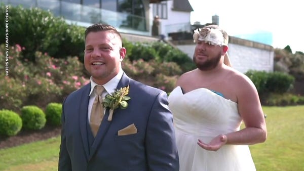 Best man pranks groom by wearing wedding dress for