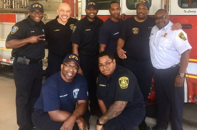 Fire Captain Ronald Wilson, bottom left, died suddenly in his home Thursday. He was a 25-year veteran of the Cincinnati Fire Department.