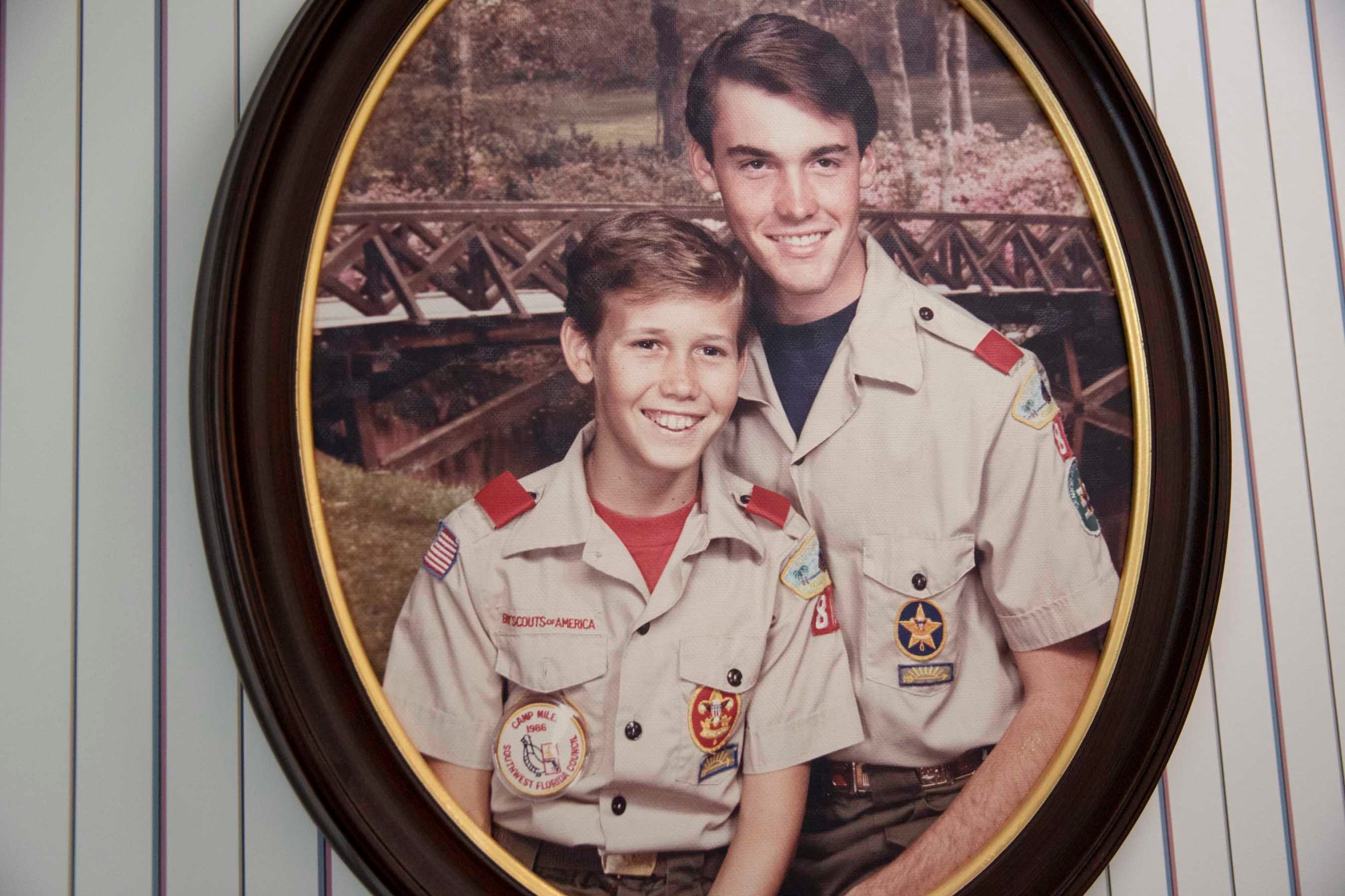 A portrait of Aaron Averhart and his older brother Scott Adkins hangs on a wall at their parents' house in North Fort Myers on Wednesday, Sept. 4, 2019. Averhart says that when he attended Camp Miles in the late 1980s as a young Boy Scout, he was sexually abused by the camp's waterfront director, Bill Sheehan.