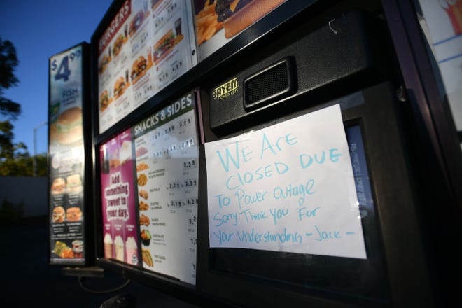 A Jack in the Box restaurant drive-thru has a sign posted indicating closure as a statewide blackout takes effect in Santa Rosa, California on October, 10, 2019. - Rolling blackouts set to affect millions of Californians began October 9, as Pacific Gas & Electric started switching off power to an unprecedented number of households in the face of hot, windy weather that raises the risk of wildfires. PG & E, which announced the deliberate outage, is working to prevent a repeat of a catastrophe last November in which faulty power lines it owned were determined to have sparked California's deadliest wildfire in modern history. (Photo by Josh Edelson / AFP) (Photo by JOSH EDELSON/AFP via Getty Images)