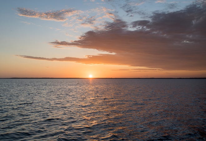 The sun sets over Perdido Bay in October 2019. Florida Department of Environmental Protection investigators have determined the release of turbid water from a subdivision construction site in September caused "a significant impact" to the bay.