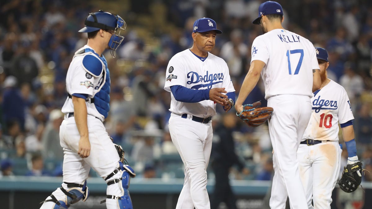 Los Angeles Dodgers manager Dave Roberts pulls Los Angeles Dodgers relief pitcher Joe Kelly after giving up a grand slam to Washington Nationals Howie Kendrick in the top of the 10th inning.