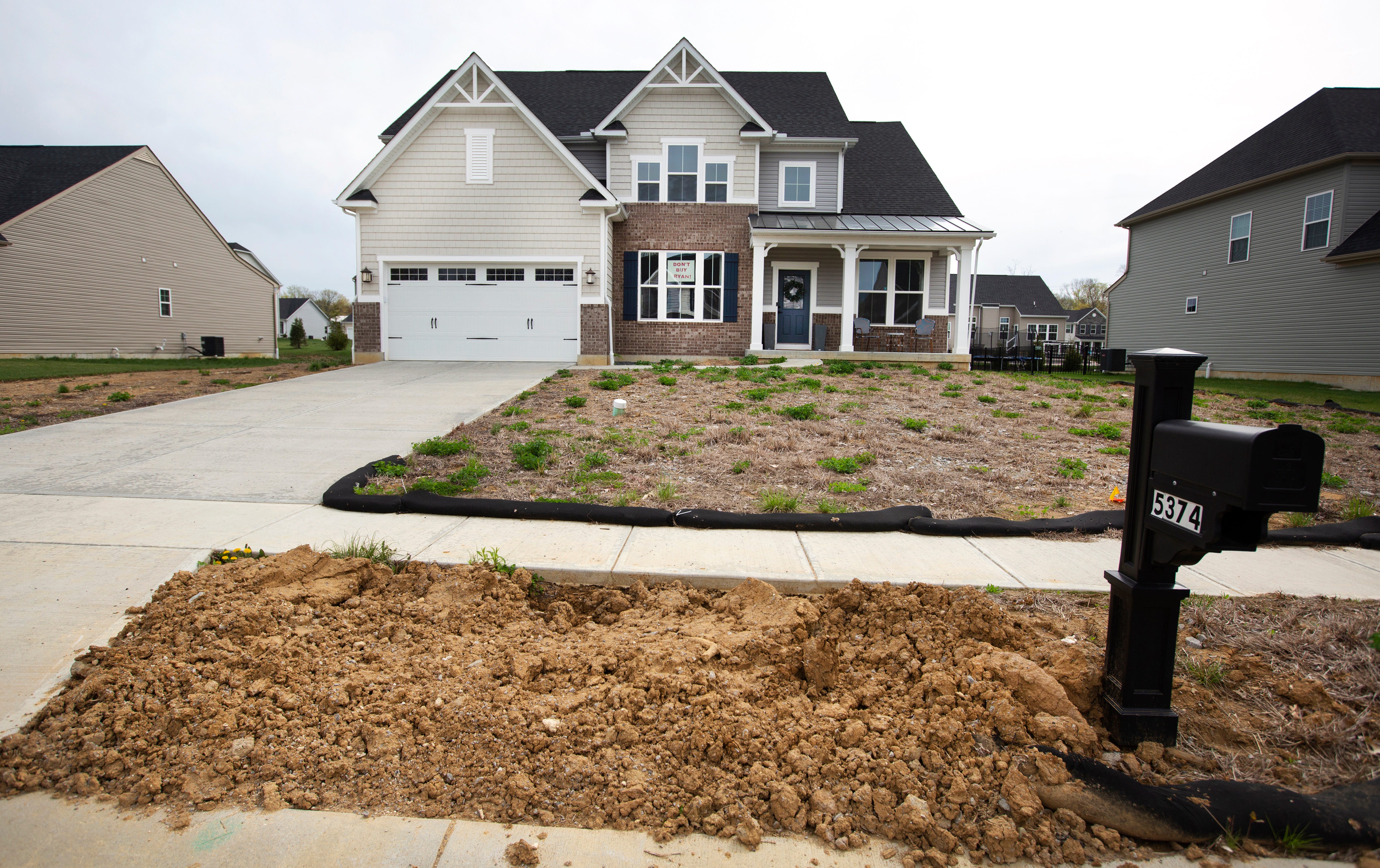 Sixteen months after Mike and Tasha Amos moved into what they thought would be their 'dream home' in Milford, Ohio outside Cincinnati, their front lawn still had not been landscaped and their mailbox was in the wrong spot.