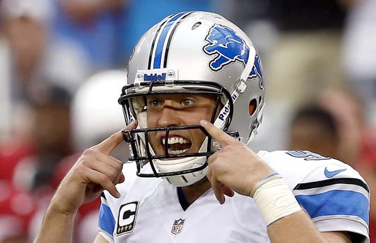 Detroit Lions' Matthew Stafford signals to his wide receivers during the second half in an NFL football game against the Arizona Cardinals on Sunday, Sept. 15, 2013, in Glendale, Ariz.  The Cardinals defeated the Lions 25-21. (AP Photo/Ross D. Franklin)