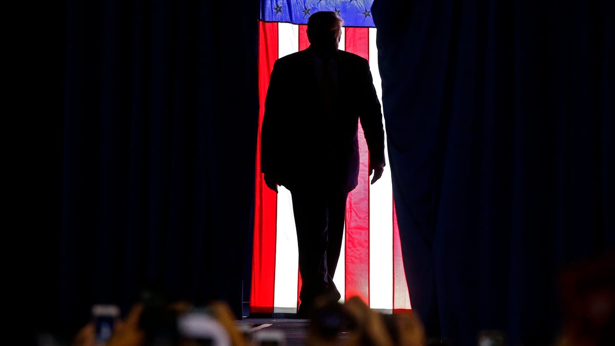 President Donald Trump walks onto the stage at a rally inside the Sudduth Coliseum in Lake Charles, Louisiana, on Oct. 11, 2019.