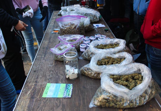 Ounces of marijuana on a table at High Times Cannabis Bazaar at Russell Industrial Center in Detroit, Saturday, Oct. 12, 2019.