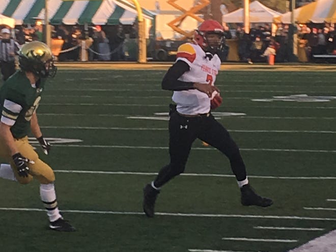 Jayru Campbell runs for some yardage during the first half.