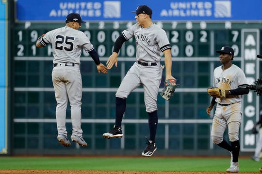 New York Yankees second baseman Gleyber Torres, left, and right fielder Aaron Judge celebrate after their win against the Houston Astros in Game 1.