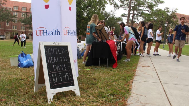 Students register to dance during the Child Health Day event Dance Marathon held last Monday on Landis Green.