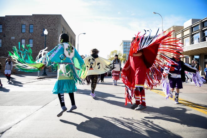Members of the Washington High School Okichiyapi Club dance during the Native American Day parade on Monday, Oct. 14, 2019. This years theme was "Celebrating Our History: Inspiring the Future."