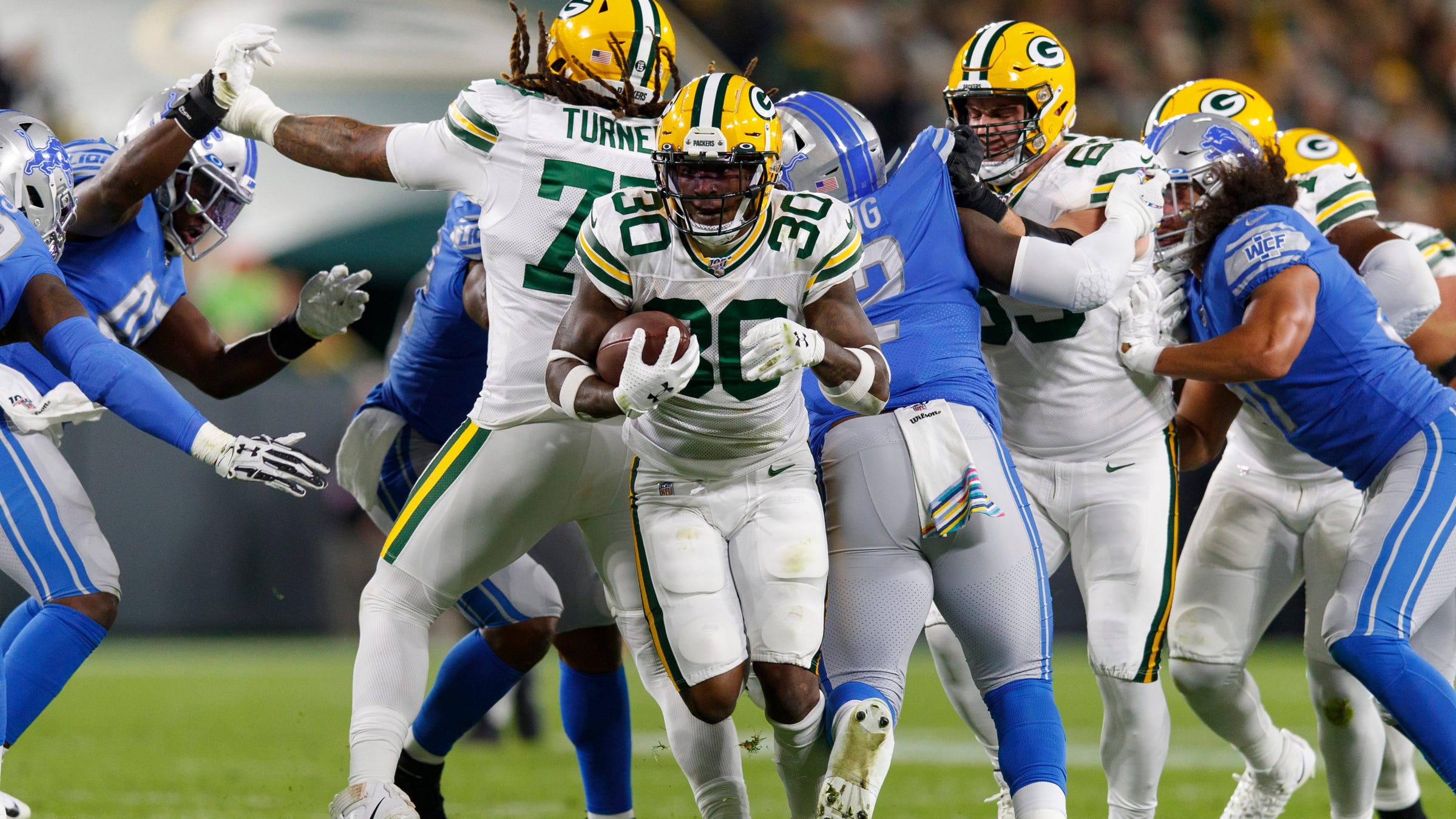 Green Bay Packers running back Jamaal Williams rushes with the football during the second quarter against the Detroit Lions at Lambeau Field in Green Bay, Wis., Oct. 14, 2019.
