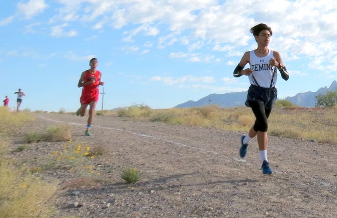Sophomore Wildcat Esau Au (in front)  led the Deming High varsity boys with a 37th place finish in the time of 19:33 on Saturday at the Centennial Cross Country Meet in Las Cruces.