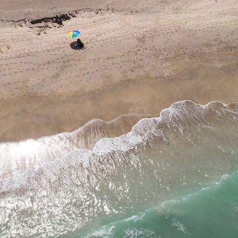 Beachgoers relax at Jensen Beach, seen in a drone 