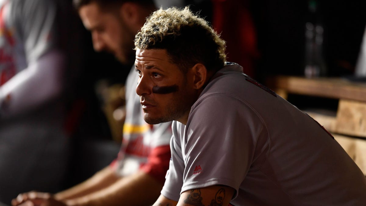 Yadier Molina looks on from the dugout during the Game 3 loss.