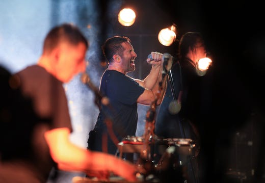 LOS ANGELES, CA - JULY 23: (L-R) Atticus Ross, Trent Reznor and Robin Finck of Nine Inch Nails perform onstage on day 3 of FYF Fest 2017 at Exposition Park on July 23, 2017 in Los Angeles, California. (Photo by Christopher Polk/Getty Images for FYF)