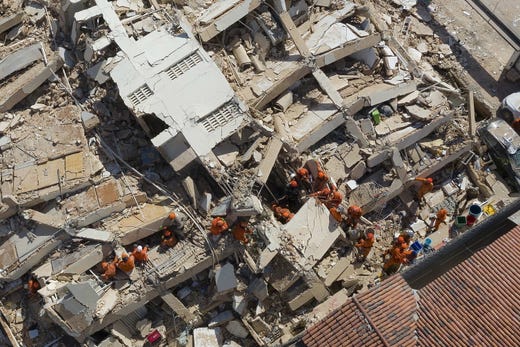 Firemen and rescue personnels work at the scene where a seven-story residential building collapsed in Fortaleza, Brazil, 15 October 2019. At least two people died and other three are injured while dozen still missing after the seven-story residential building collapsed, according to firemen.