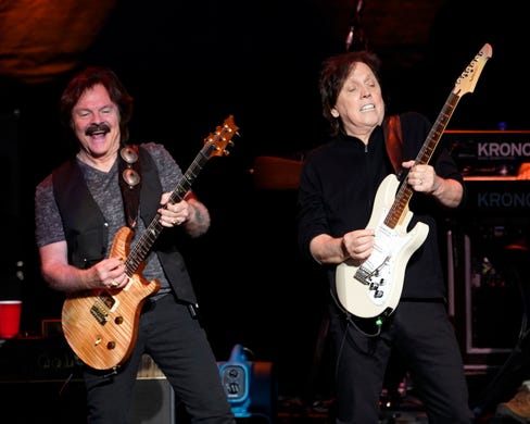 The American iconic rock band, The Doobie Brothers with lead guitarist Tom Johnston and guitarist John McFee performs at the Xfinity Center, Saturday, July 7, 2018, in Mansfield, Mass..(Photo by Robert E. Klein/Invision/AP)