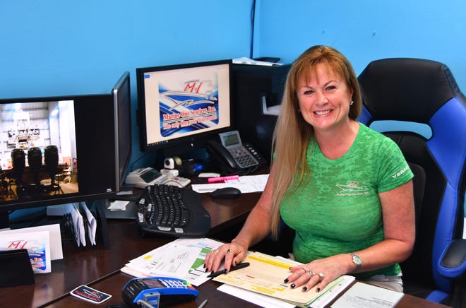 Marine One Services Inc. at Port Canaveral is nominated for Business of the Year, with the company praised for its efforts to help animals in need. Michelle Nicholas, owner and vice president, is pictured in her Port Canaveral office.