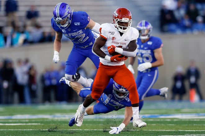 Oct 12, 2019; Colorado Springs, CO, USA; Fresno State Bulldogs wide receiver Emoryie Edwards (4) runs past the tackle of Air Force Falcons defensive back Grant Theil (14) and defensive back Garrett Kauppila (22) in the first quarter at Falcon Stadium. Mandatory Credit: Isaiah J. Downing-USA TODAY Sports