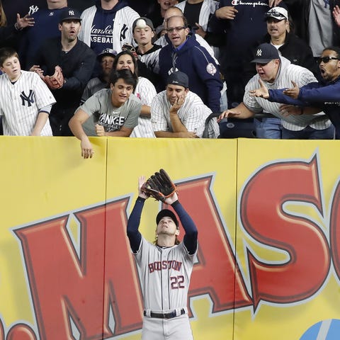 Yankee fans jump on Astros right fielder Josh Redd