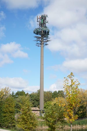 A cell phone relay tower stands near the northeast intersection of Fourteen Mile and Orchard Lake. Metalic "branches" have been added to it so that it mimics an evergreen tree. A similar-looking tower for Milford was just denied.