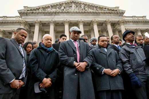 Elijah Cummings and congressional staff members gather at the Capitol to raise awareness of the recent killings of black men by police officers, both of which did not result in grand jury indictments, in Washington on Dec. 11, 2014. 