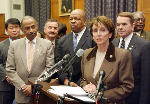 Nancy Pelosi, accompanied by Elijah Cummings and other fellow House members, meet reporters on Capitol Hill Feb. 13,2003 to announce that they filed a brief with the Supreme Court in support of the University of Michigan's affirmative action admissions policy.
