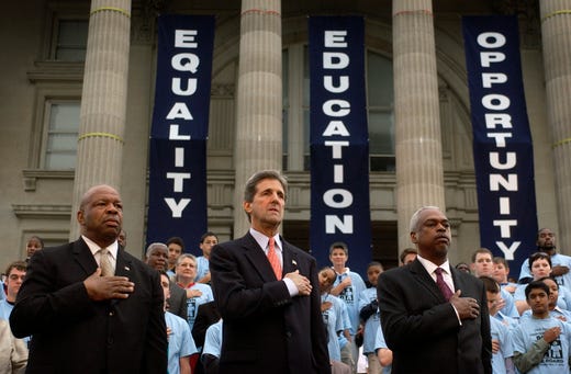  Sen. John Kerry, D-Mass., stands with U.S. Rep. Elijah Cummings, D-Maryland, left, and Leadership Conference on Civil Rights Executive Director Wade Henderson, right, at a ceremony commemorating the 50th anniversary of the Brown v. Board of Education decision, ending racial segregation in schools on May 17, 2004, in Topeka, Kan. 