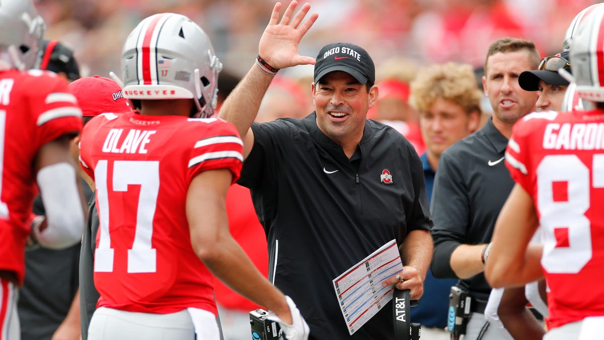 Ohio State coach Ryan Day, center, celebrates with his team after a touchdown against Florida Atlantic in their 2019 season opener.