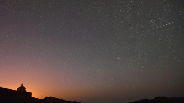 An Orionid meteor shoots across the sky on Thursda