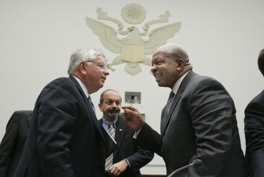 National Basketball Association Commissioner David Stern speaks with Rep. Elijah Cummings after testifying about steroid use in professional sports before the House Committee on Government Reform on Capitol Hill May 19, 2005 in Washington, DC.